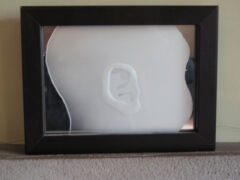 Sandblasted onto mirror - babies head